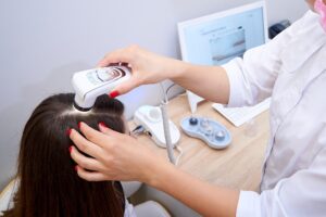 Examination of the patient's hair and scalp in the clinic
