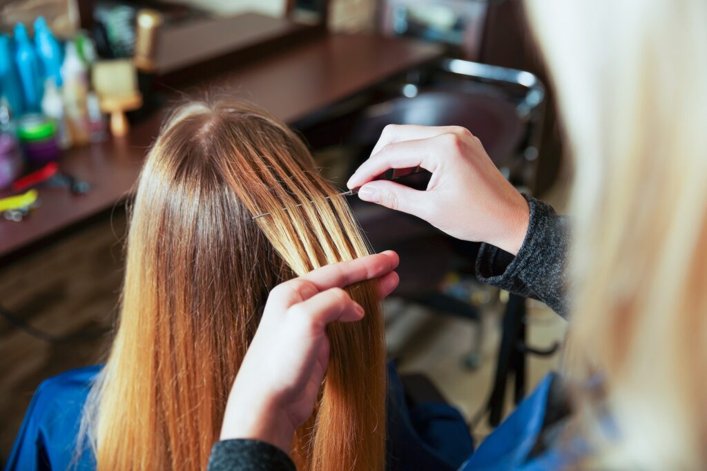 Professional hairdresser uses foil.